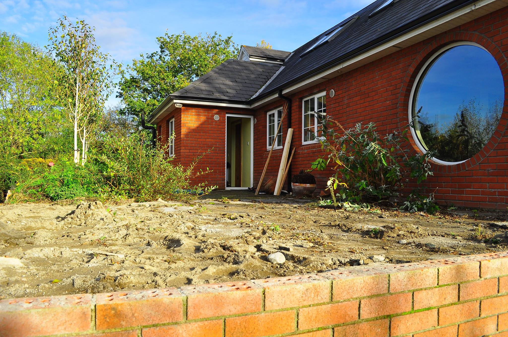 view of the back of a house where a patio is to be laid.