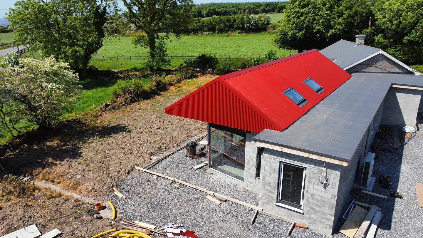 Corrugated sheeted red roof installed on a house