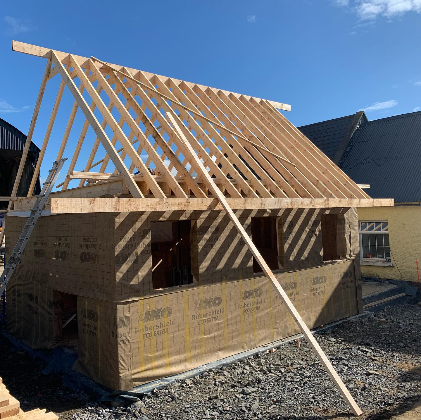 timber frame extension with insulation wrap