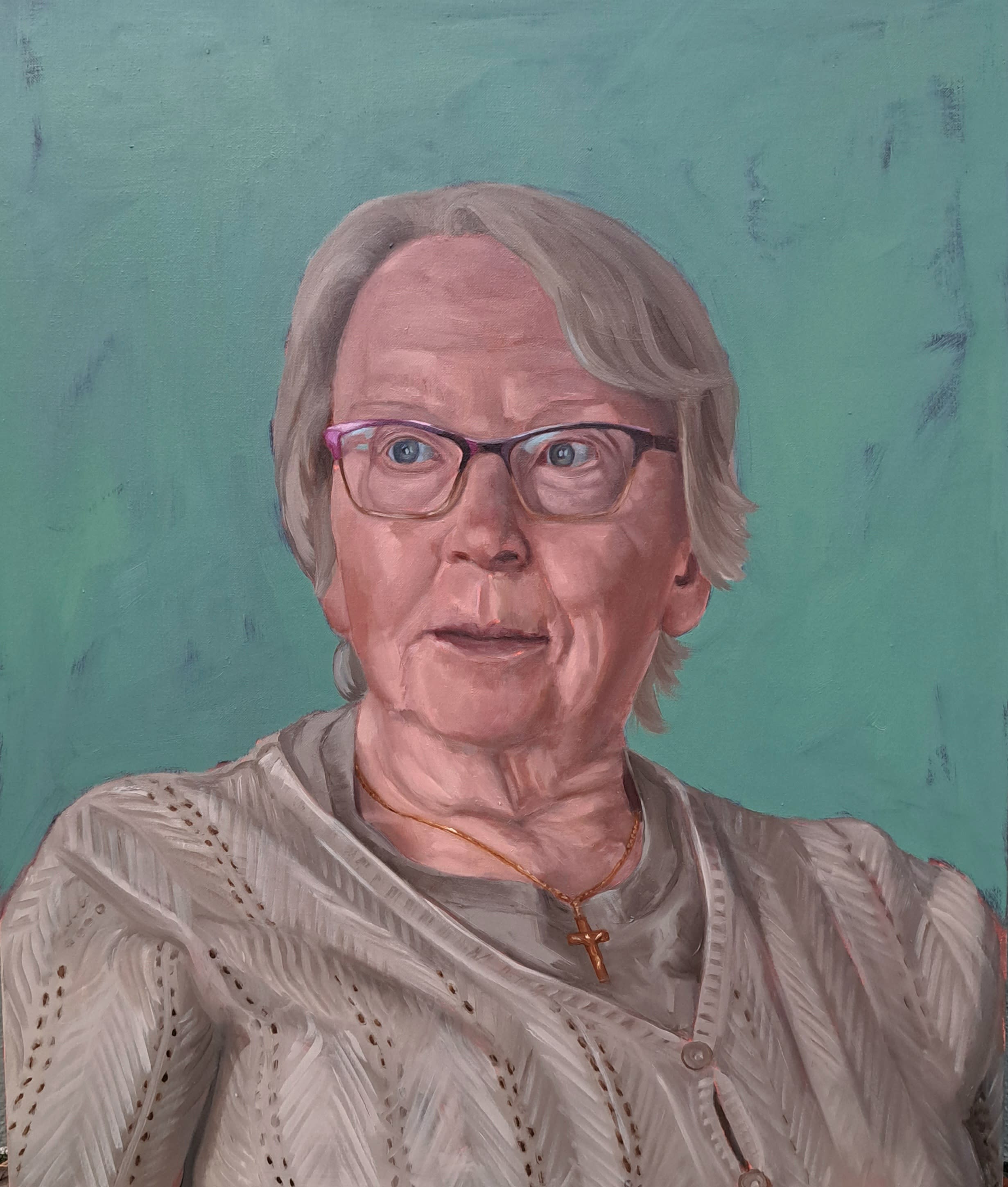 portrait of a man sitting in a chair reading a book