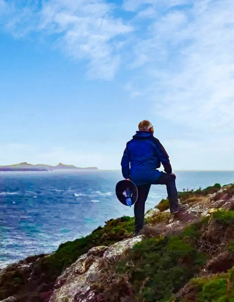 Silhouette-of-walker-on-coastline-cropped