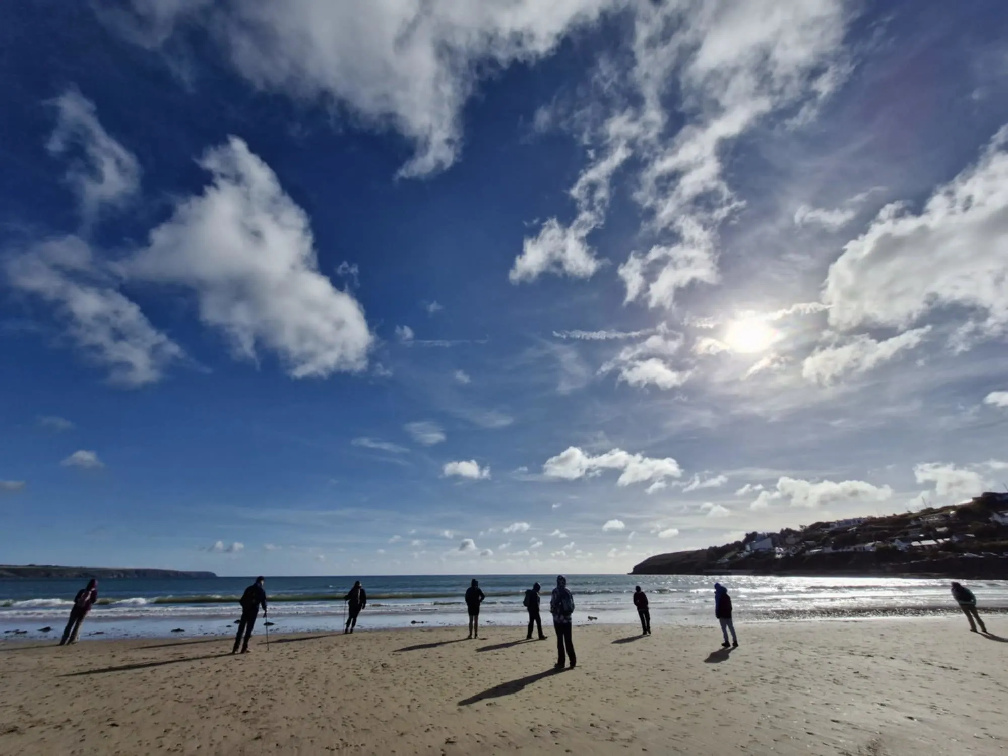 Tour walkers on a beach in Ardmore Co. Waterford Ireland