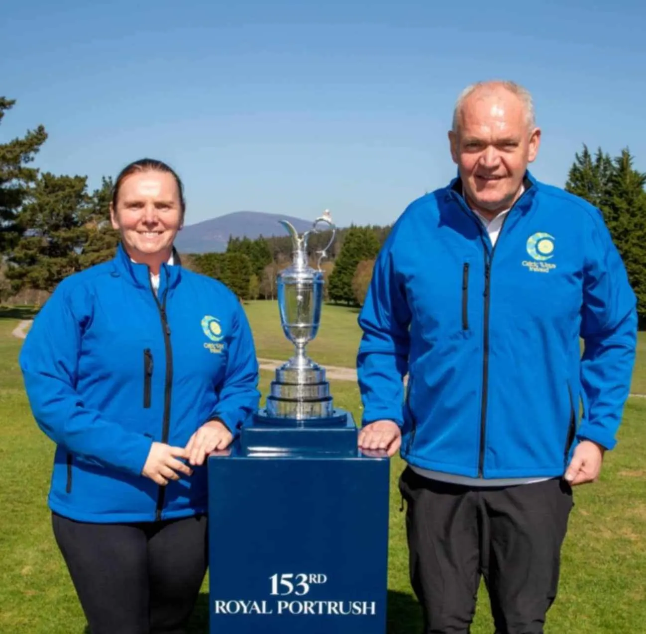 Phil and Elaine Brennan, Golf tour guides pictured with the Claret Jug Golf Trophy