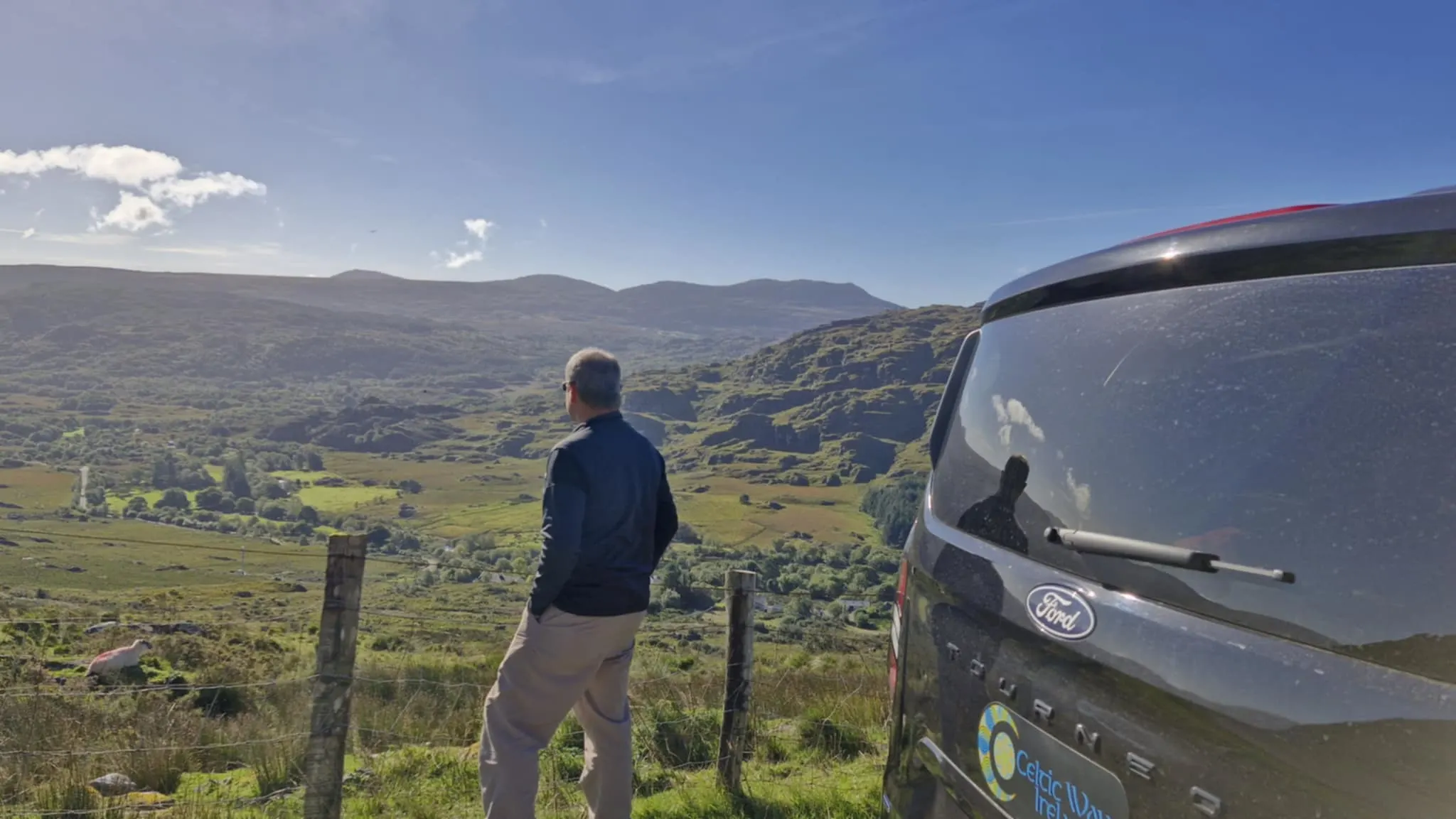 61ded122-2169-4664-91e2-c2132e727f41 Man staring out over a landscape in the west of Ireland