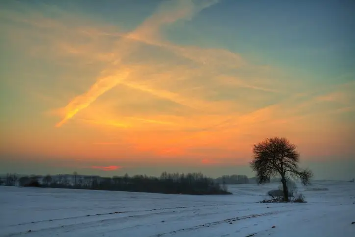 Winter landscape, amazing sundown in winter , Poland Europe, river valley Knyszyn Primeval Forest