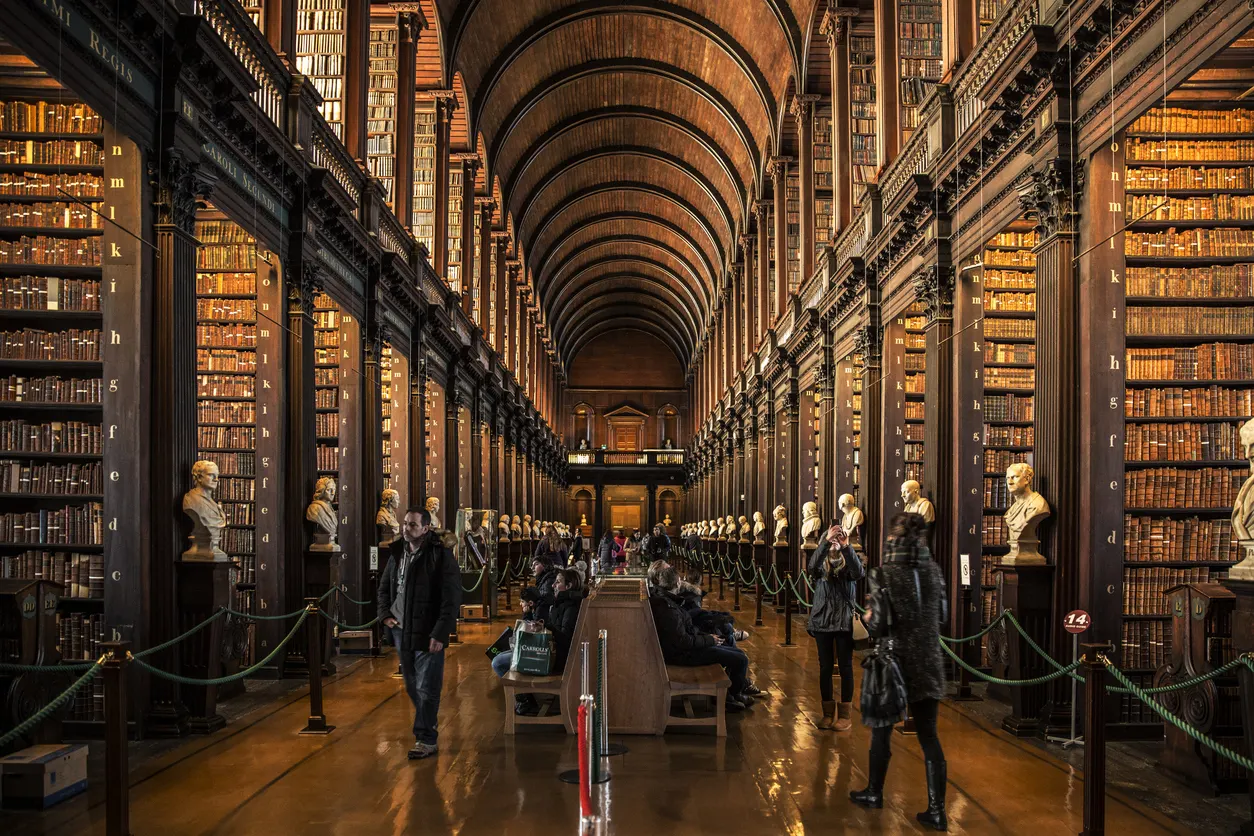A Vast Collection of Books Adorns the Shelves of an Elegant Library image inside trinity library where the Book of Kells is contained.