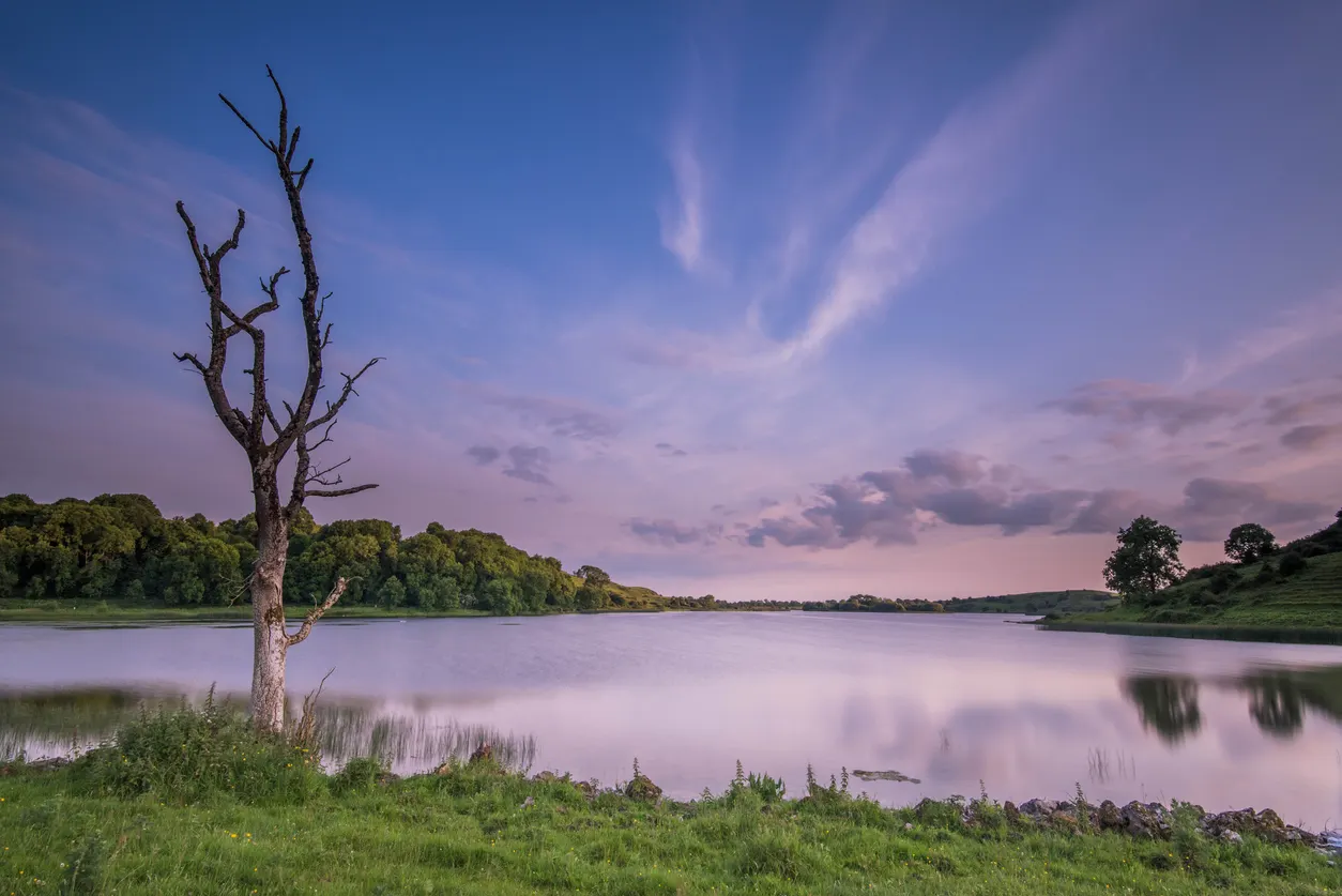 i_h82dd3ba1a895fedc8cd1f983749d4f2c5dc6a095 Lough Gur (Irish: Loch Gair) is a lake in County Limerick, Ireland between the towns of Herbertstown and Bruff. The lake forms a horseshoe shape at the base of Knockadoon Hill and some rugged elevated countryside. It is one of Ireland's most important archaeological sites. Humans have lived near Lough Gur since about 3000 BC and there are numerous megalithic remains there.