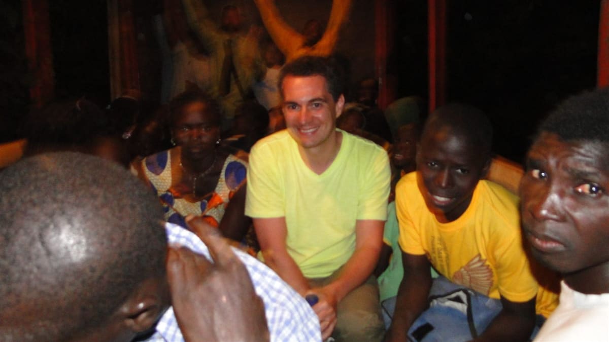 Dr Cristian Dunker with the local community at an evening gathering in Guinea-Bissau, 2013