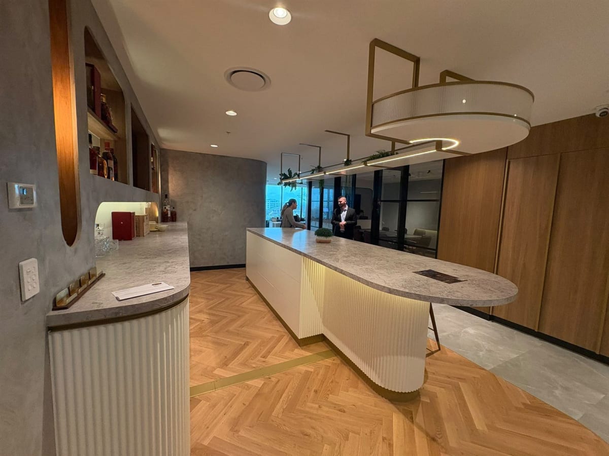 Timber herringbone floors and stone benches in ArtSmiles' new space