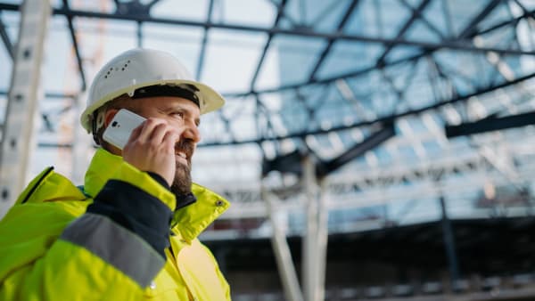 Irish tradesperson checking their website on a mobile phone