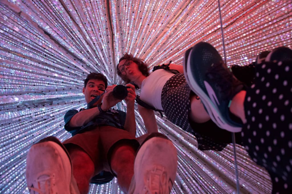 Rows of sparkling lights in the Infinite Crystals room at TeamLab Borderless