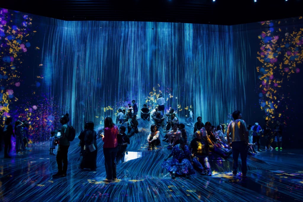 A dramatic rain installation inside TeamLab Borderless in Tokyo