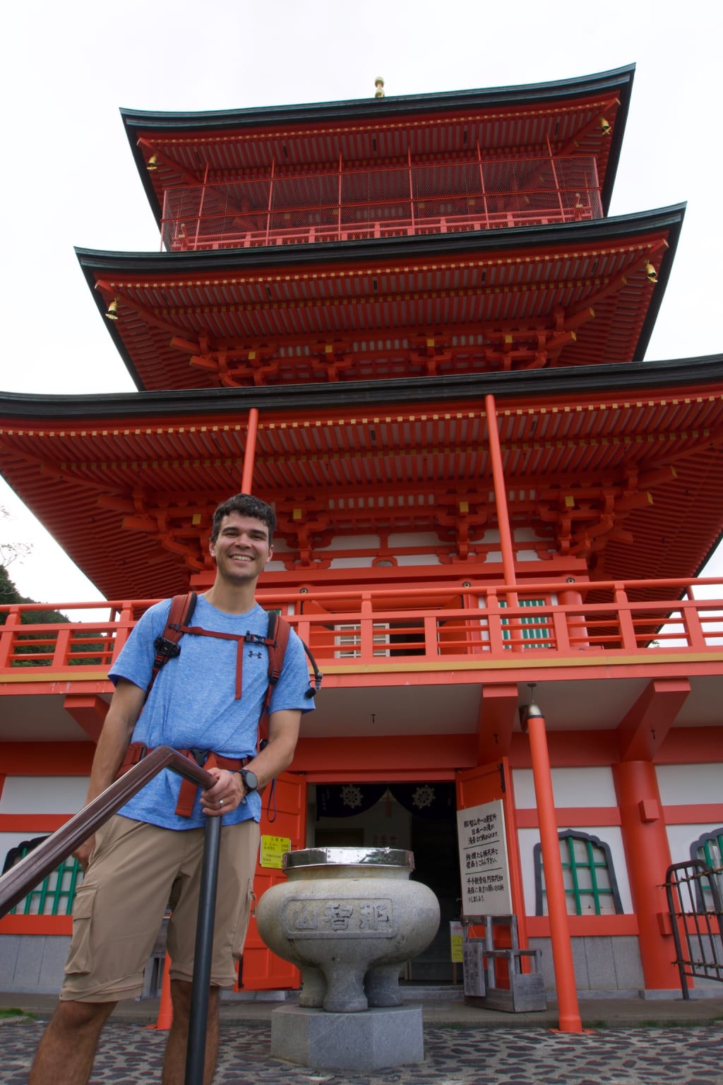Seiganto-ji and Nachi Falls surrounded by green hills