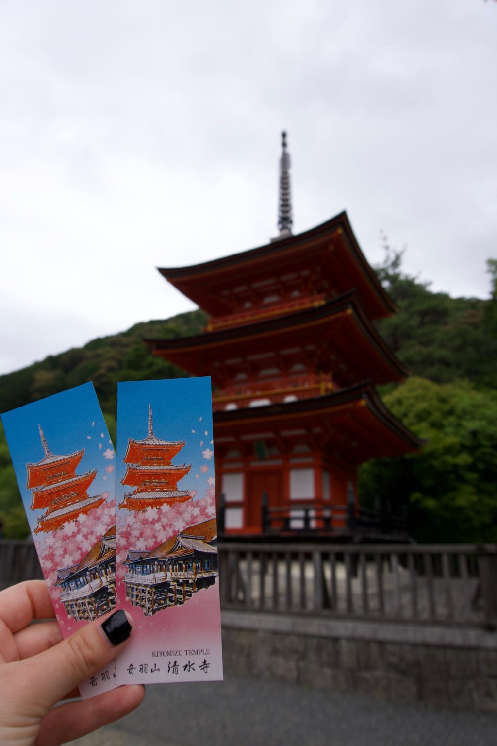 Kathryn holding her hand near the water at Kiyomizu-dera