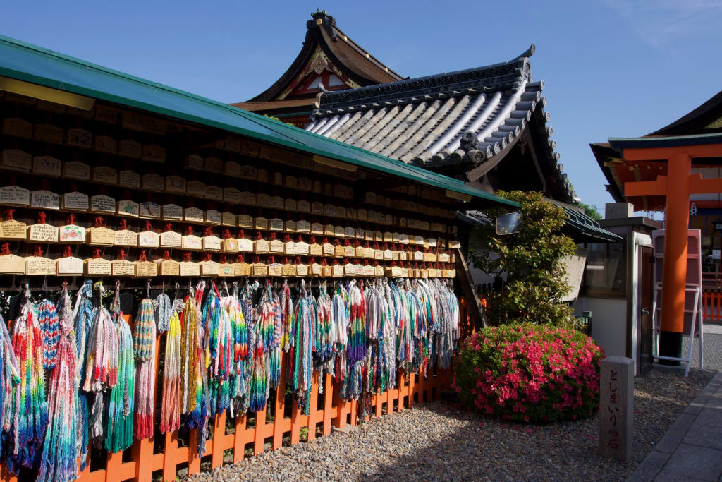Paper cranes adorning a shrine at Fushimi Inari