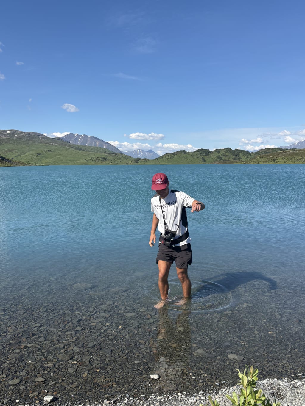 Alex wading into chilly Lost Lake water