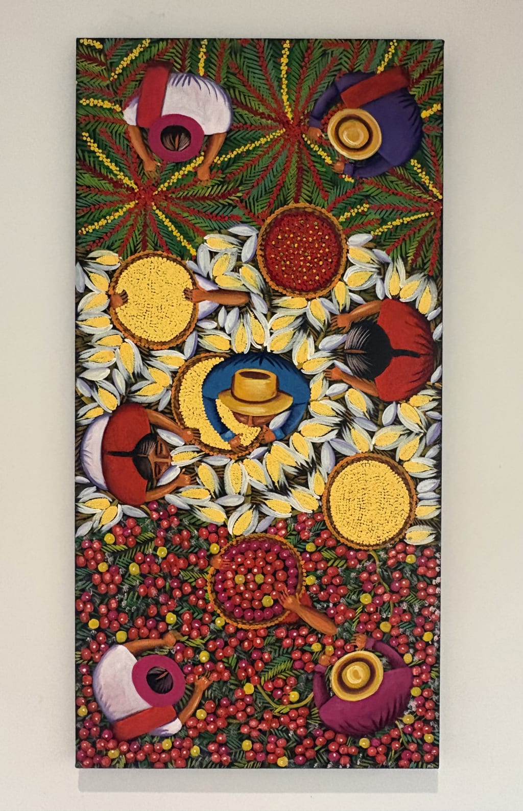 A colorful painting from Galería Ketzele hanging in a kitchen