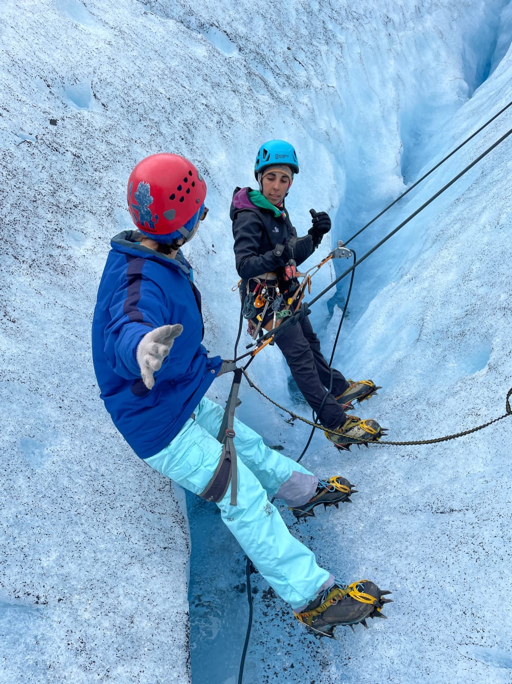 Learning proper ice climbing technique on a glacier in Norway