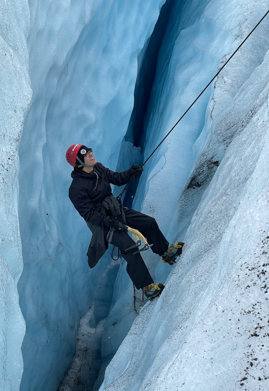 Alex ice climbing out of a crevasse on Jostedalsbreen Glacier