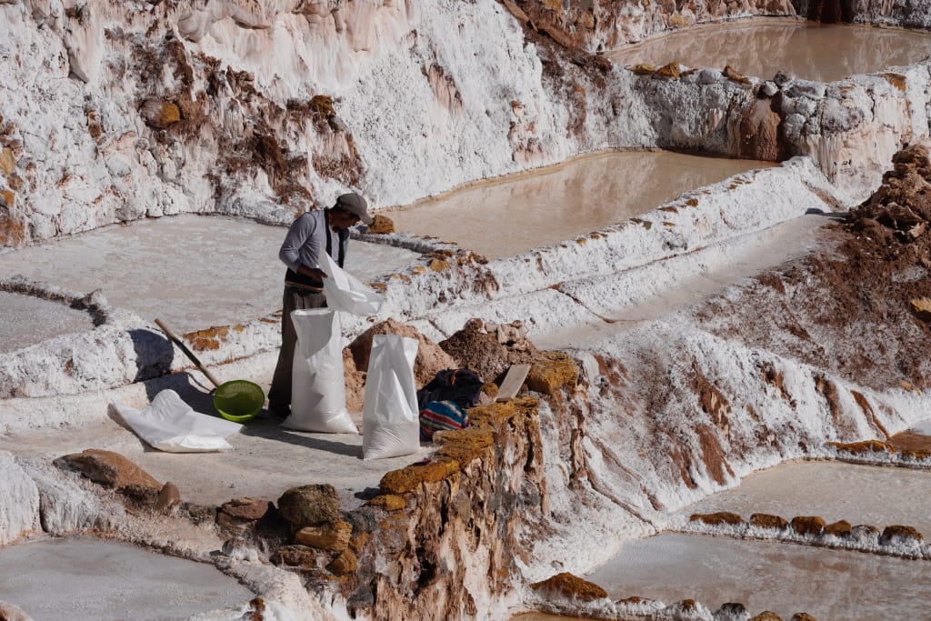 Farmers harvesting salt at Maras Salt Mines