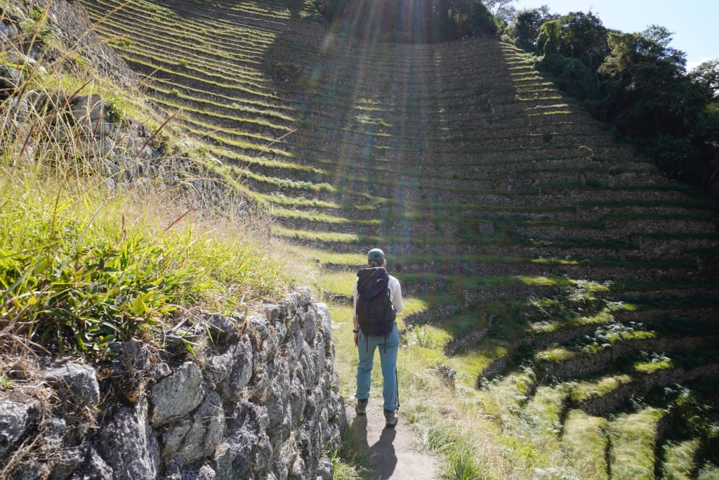 Climbing through the ruins of Wiñay Wayna on the Inca Trail