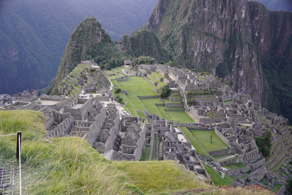 Standing above Machu Picchu at the end of the Inca Trail