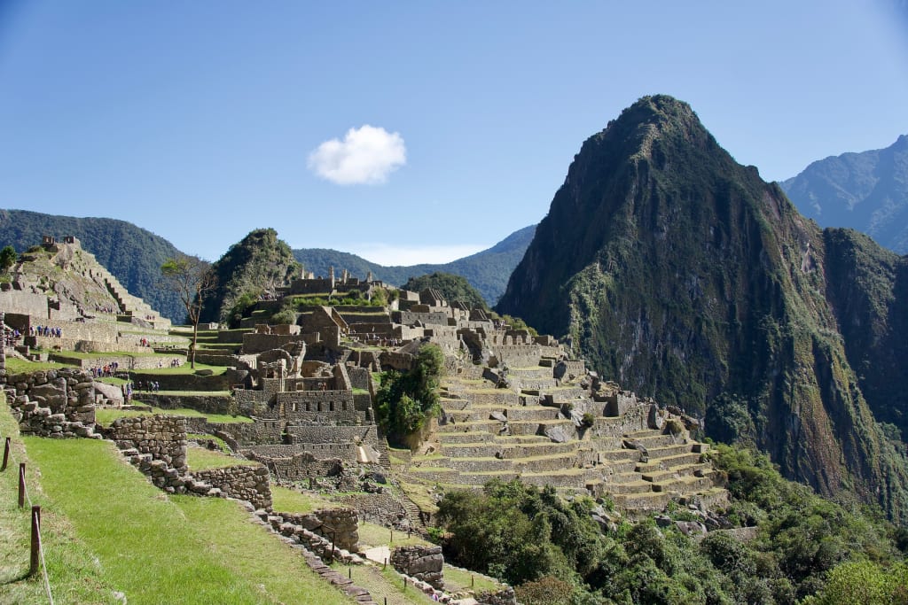 Machu Picchu ruins surrounded by green Andean mountains