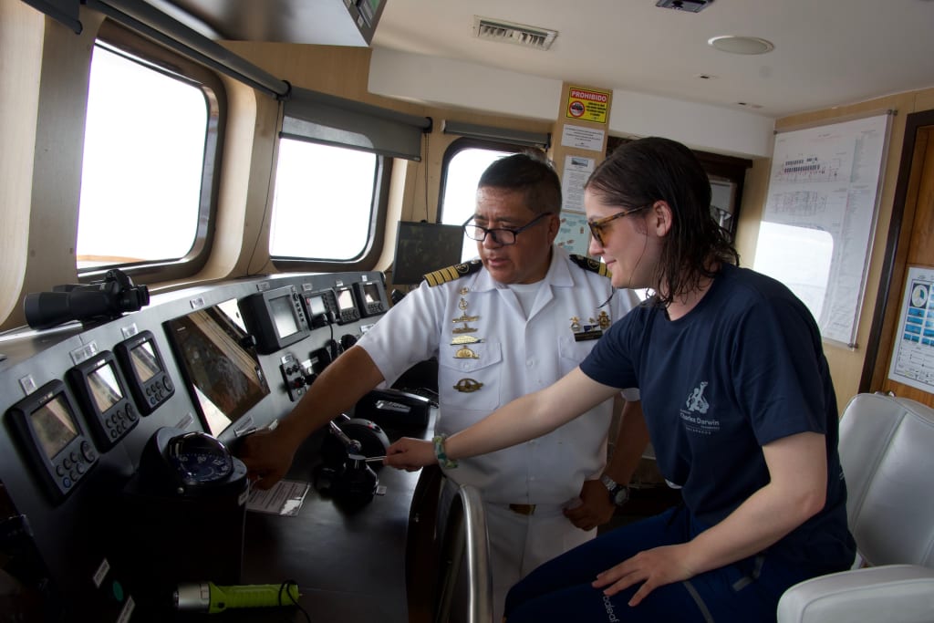 Visiting the bridge on the Ecoventura yacht