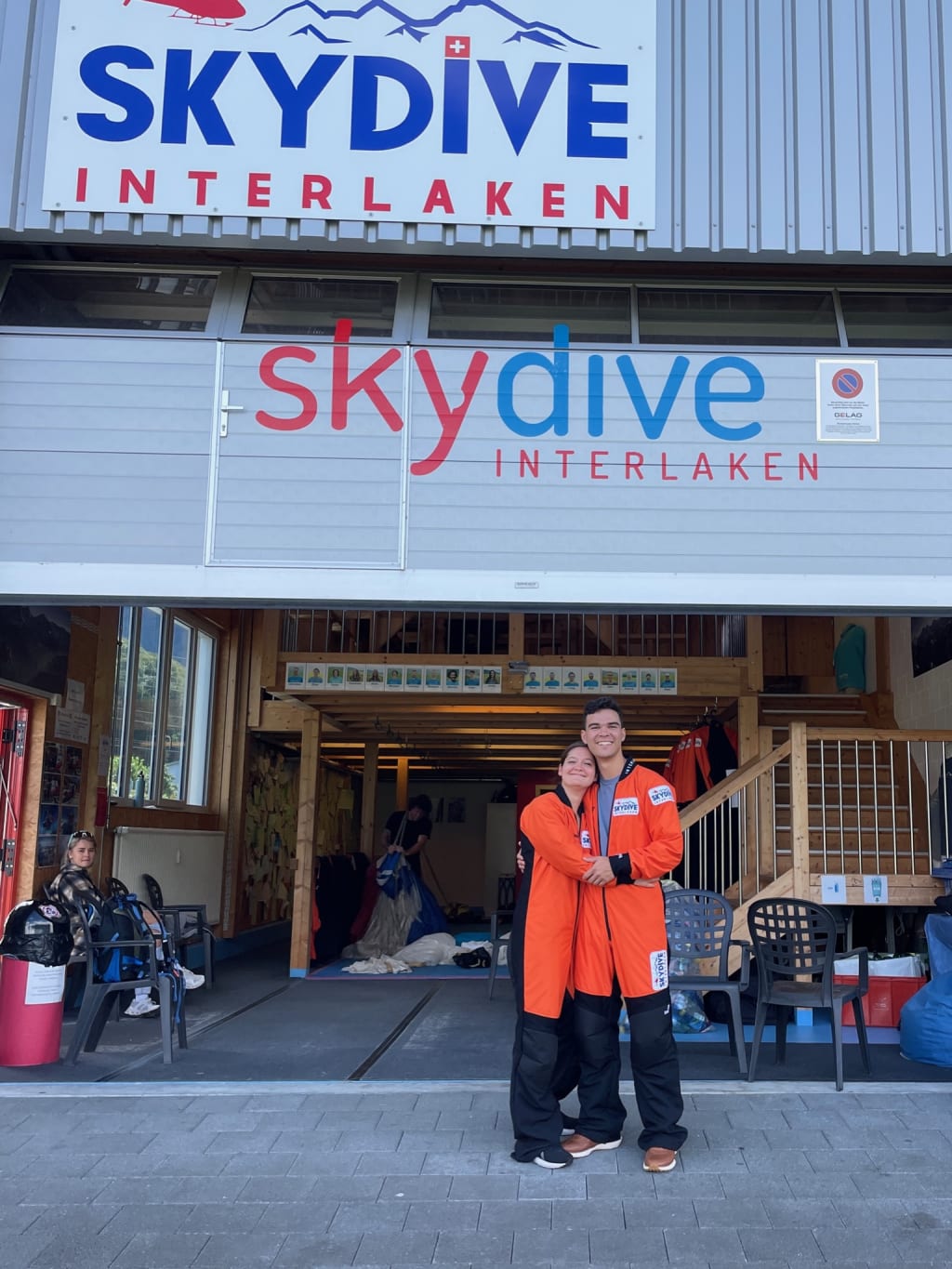In orange jumpsuits before skydiving
