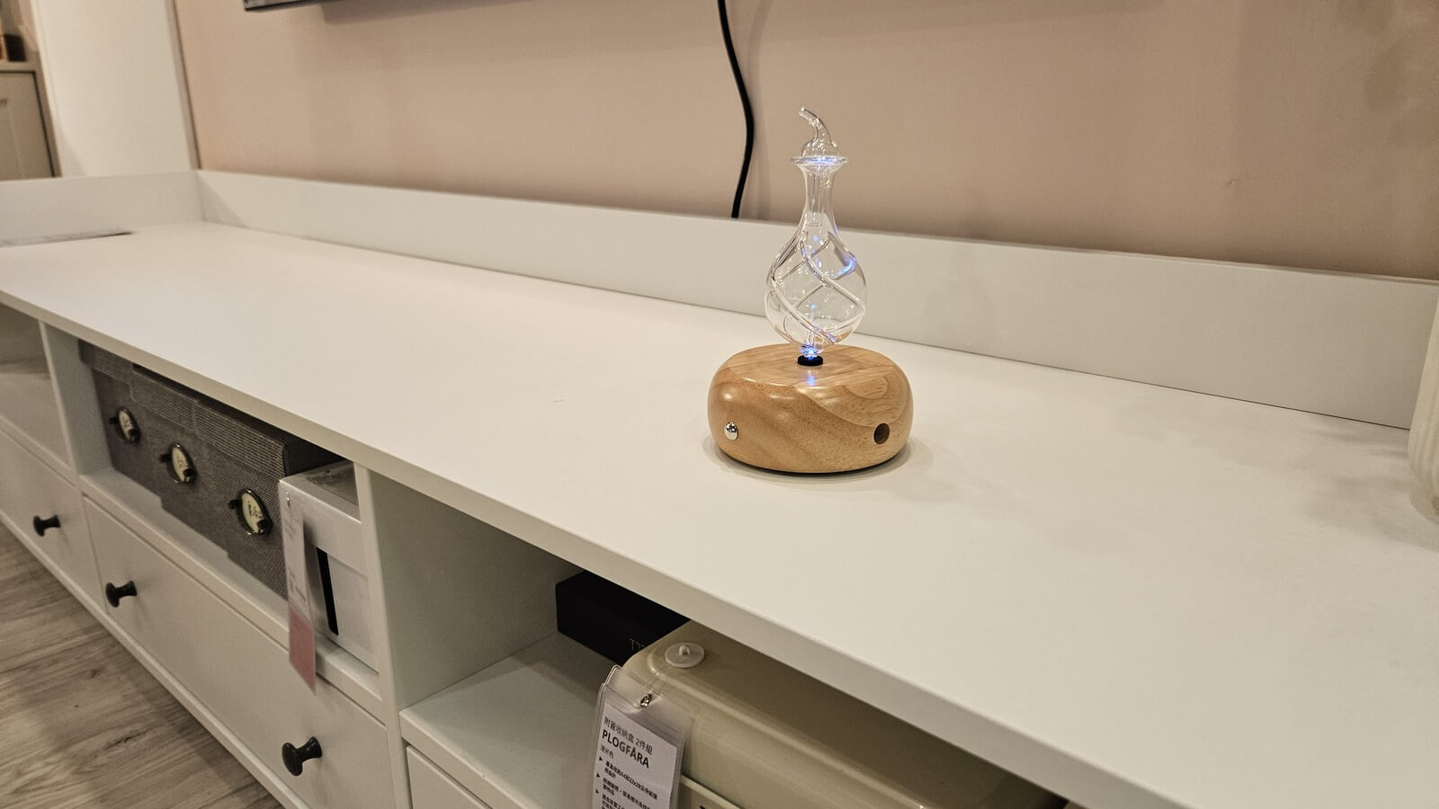 handcrafted wood and glass Nebulizing Diffuser on a console table