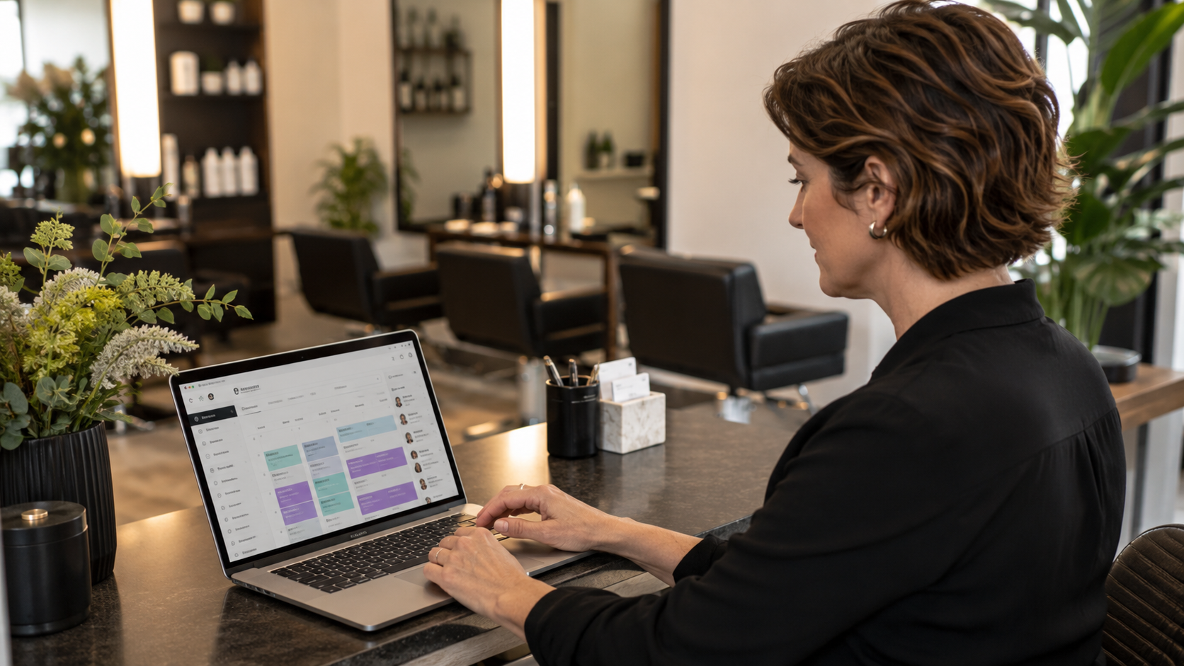 A person using a laptop to book a service online, representing convenience for local businesses.