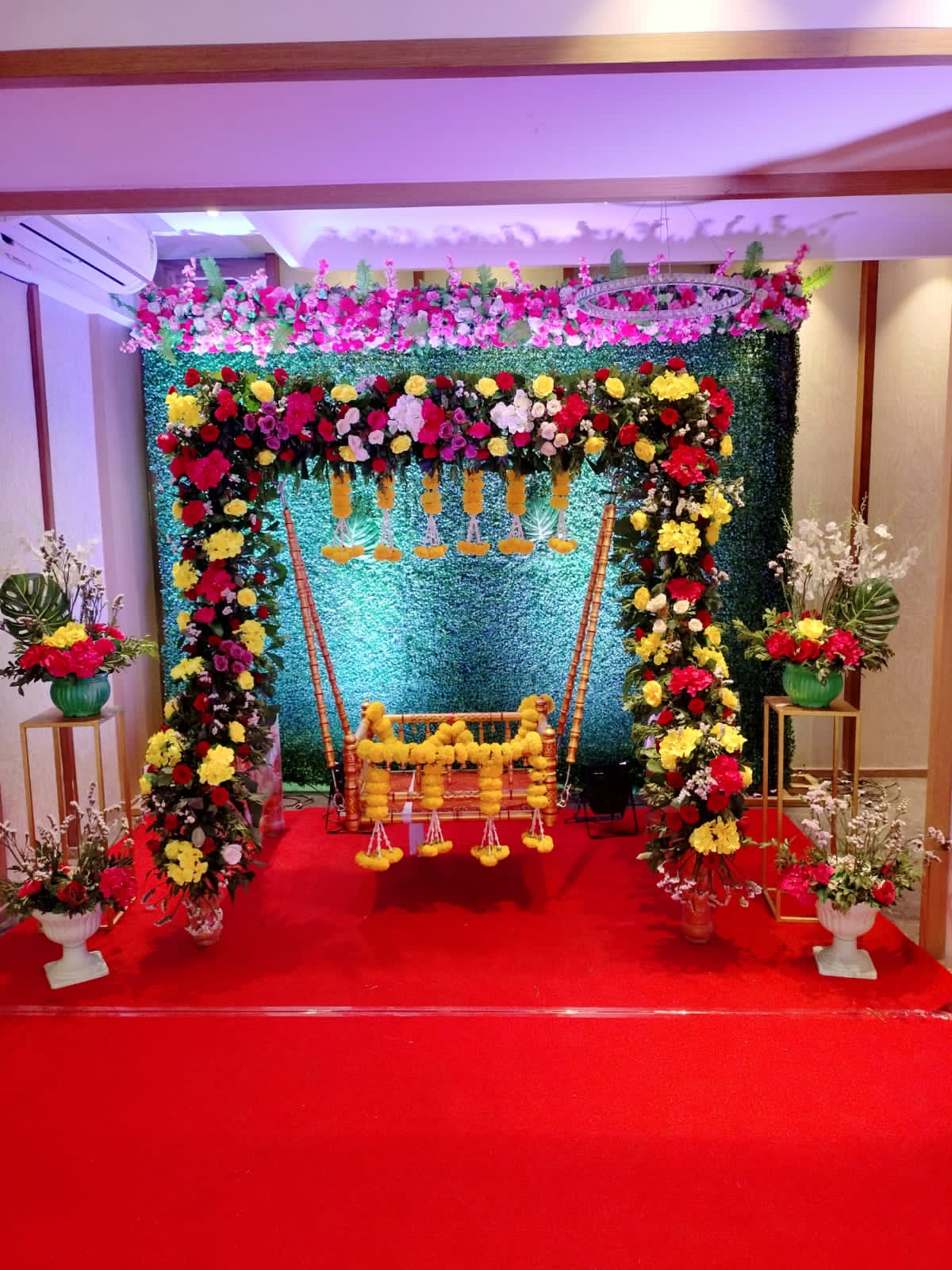 Traditional Naming Ceremony Decor with Floral Swing & Greenery Backdrop