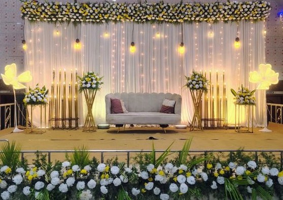 Elegant White & Gold Engagement Stage Decor with Floral Backdrop