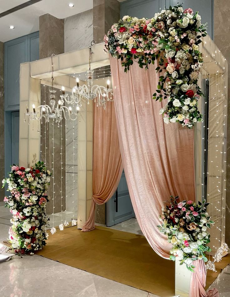 Luxurious Floral Entrance Arch With Drapes & Chandeliers