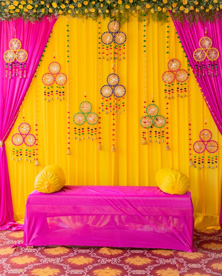 Vibrant Pink & Yellow Mehendi Ceremony Backdrop Decoration