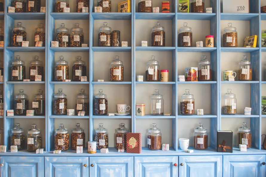 Assorted Jars on Blue Shelf Cabinets