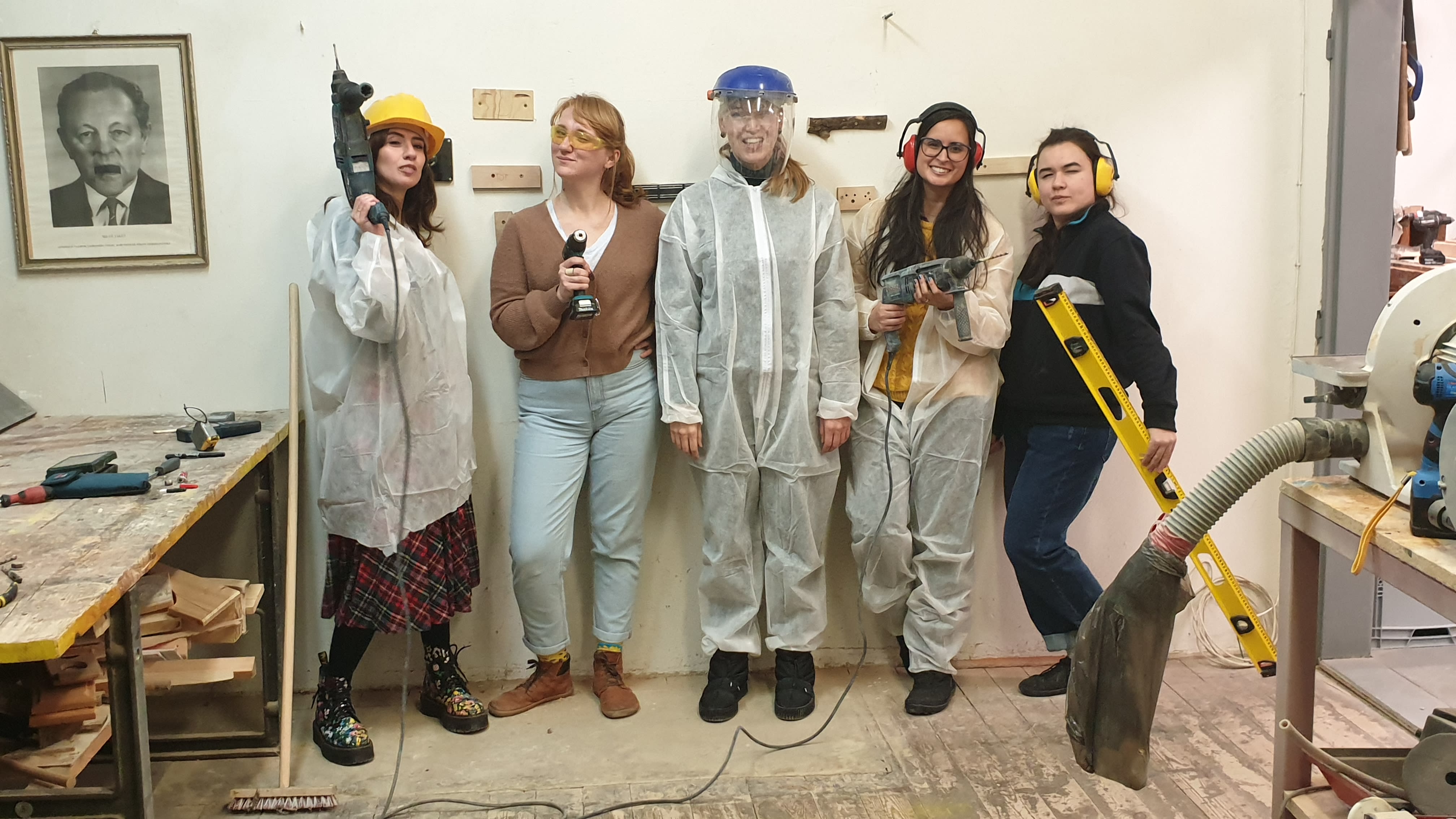 Women learning to use power tools