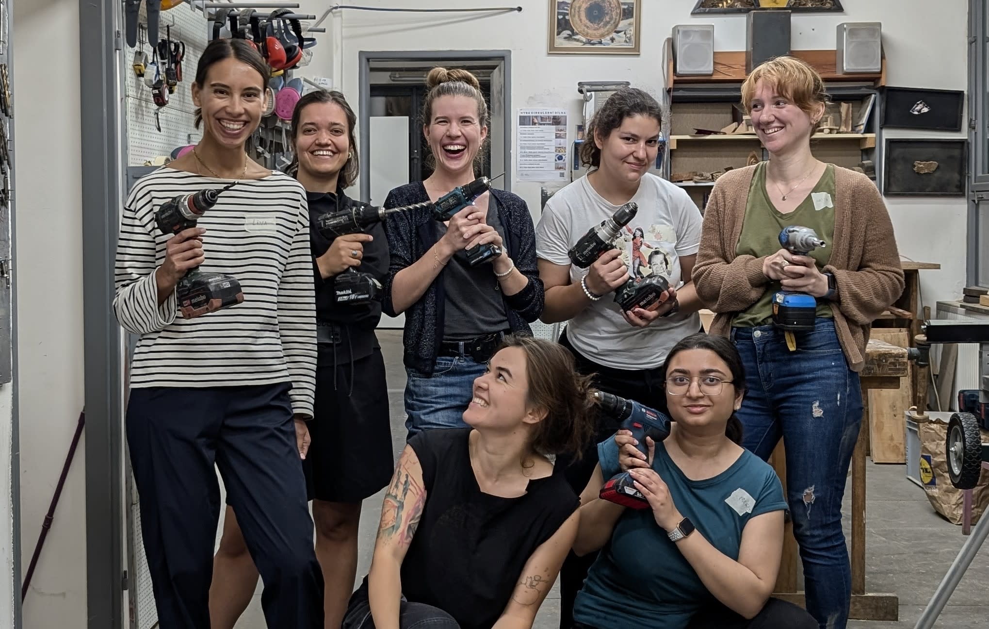Women learning to use power tools