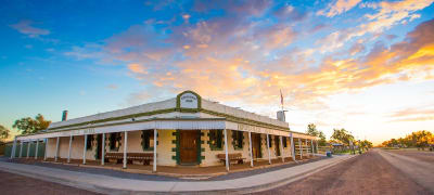 Historic Birdsville Hotel at sunset, a classic Queensland outback pub.