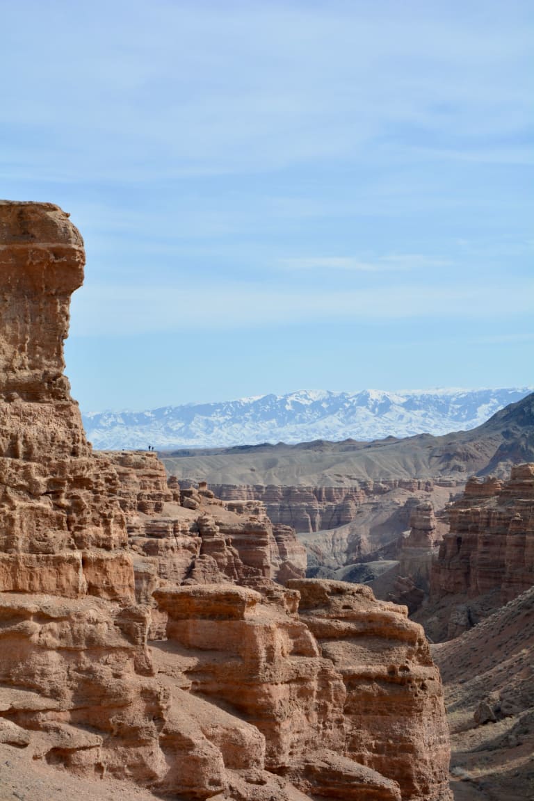 Charyn Canyon in Kazakhstan, red sandstone cliffs and the canyon floor under a blue sky