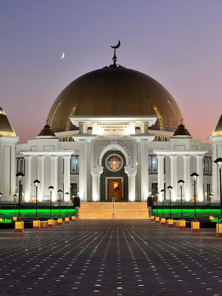White-marble mosque in Ashgabat, Turkmenistan, at twilight