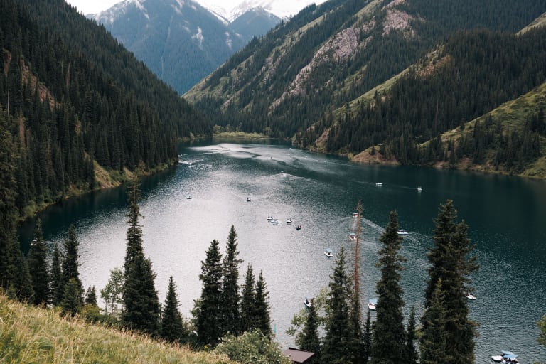Kolsay Lake in the Tien Shan near Almaty, Kazakhstan, with spruce forest on the slopes