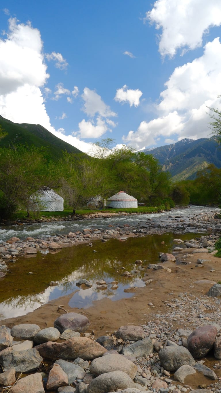 A clear mountain stream and yurts in Turgen Gorge near Almaty