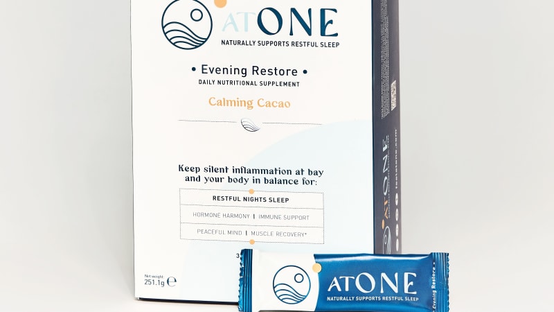AtOne Evening Restore Calming Cacao nutritional supplement box with single-serve sachet