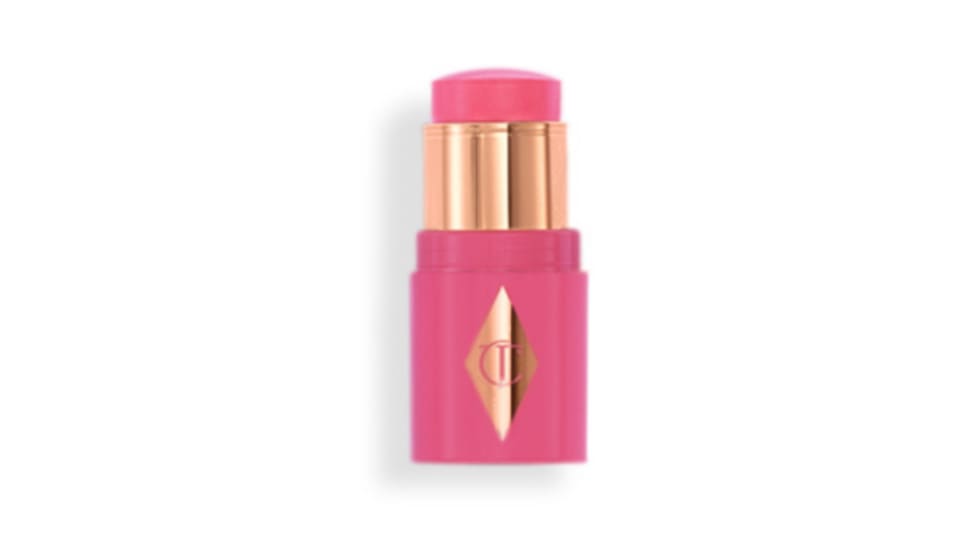 Open pink blush stick with rose-gold collar and diamond logo emblem on white background.