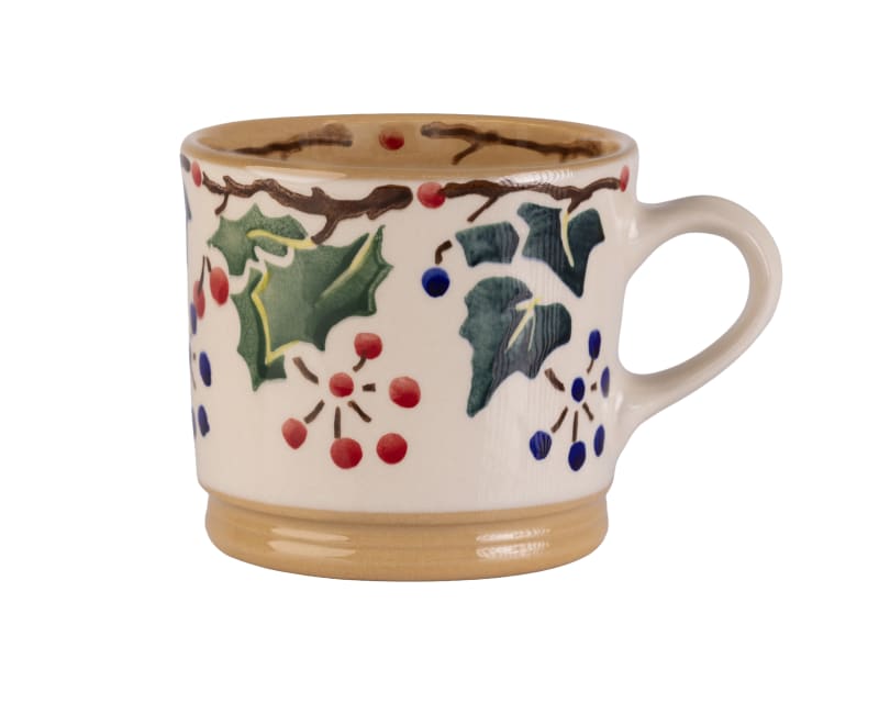 Hand-painted ceramic mug with holly, ivy leaves and berries design in cream with tan trim