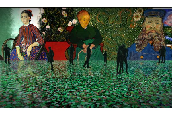 Immersive Van Gogh exhibition with large projected portraits and visitors silhouetted against illuminated walls