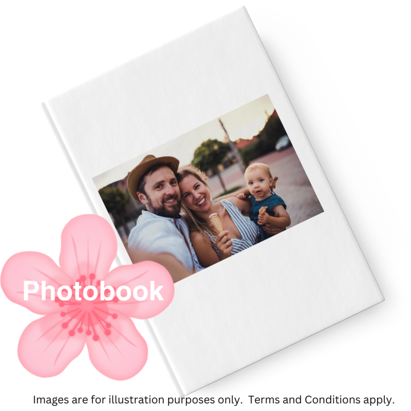 White hardcover photobook featuring a family photo of couple with baby on the cover