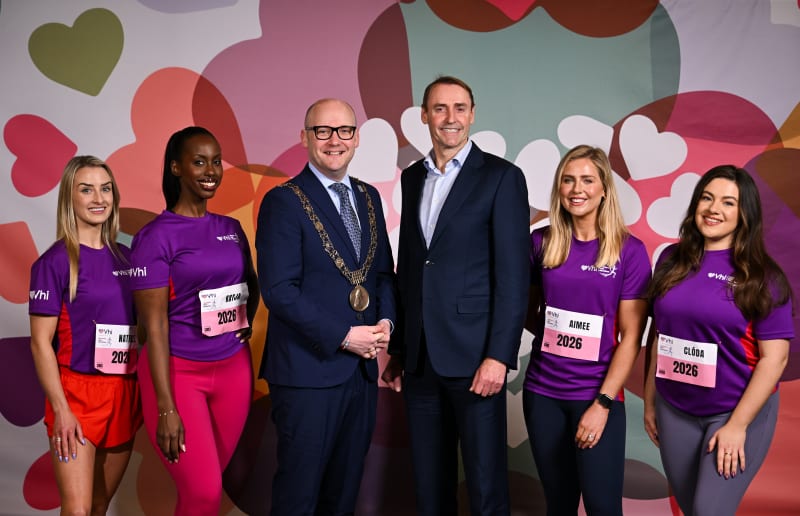 Group photo at VHI Women's Mini Marathon 2026 launch with Lord Mayor and participants in purple VHI shirts