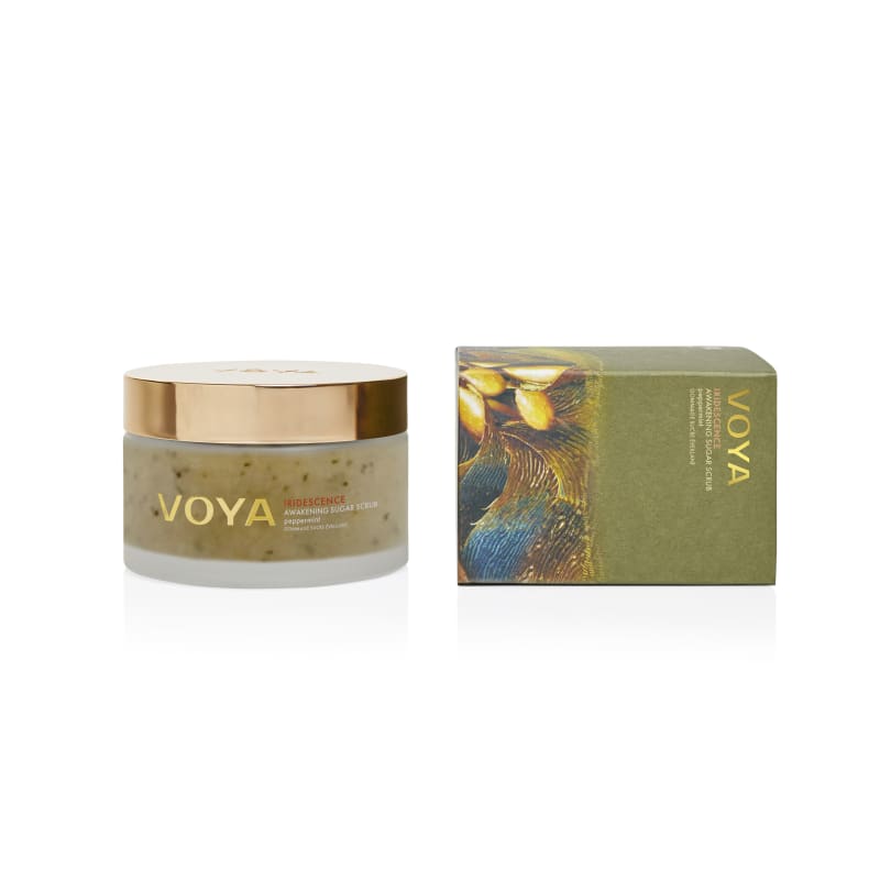 VOYA Iridescence Awakening Sugar Scrub peppermint jar with rose gold lid beside its olive-green gift box.